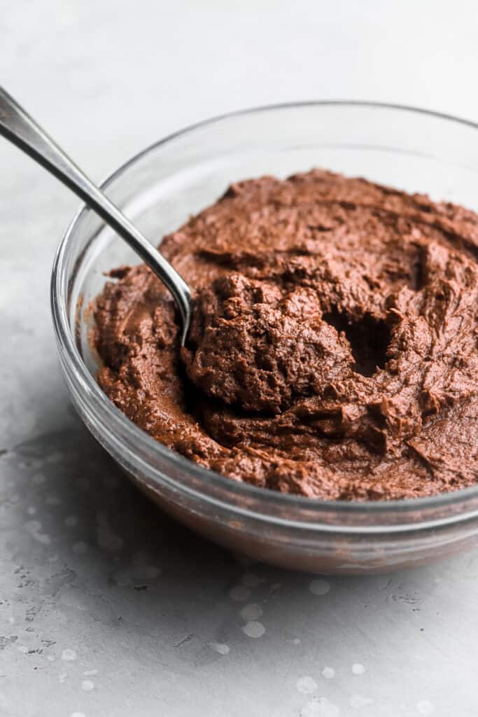 Keto Chocolate Frosting in a bowl with a spoon