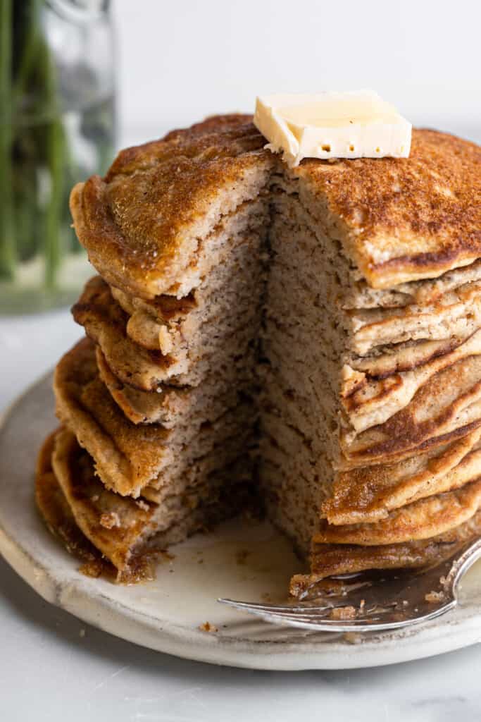 a large stack of Keto Coconut Flour Pancakes on a plate