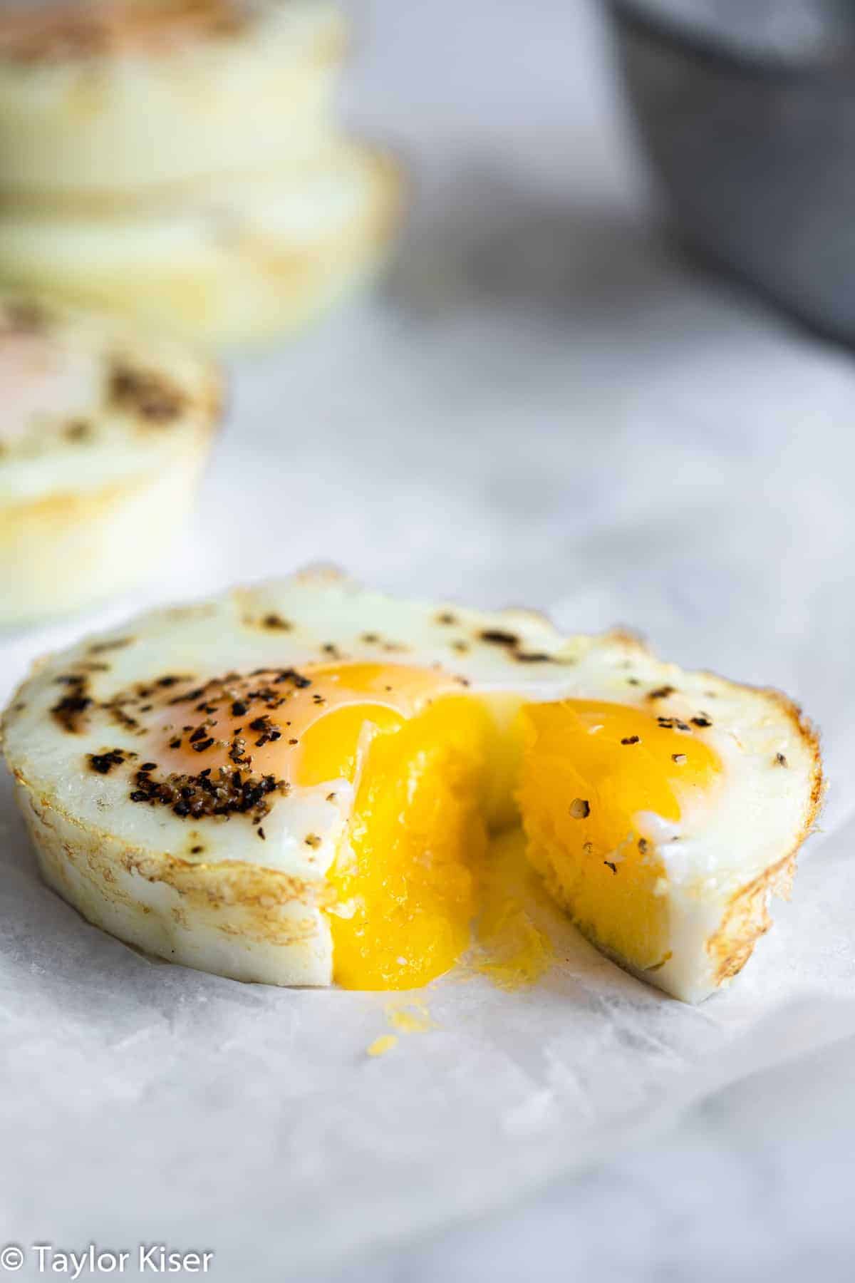 oven baked eggs cut open with a runny yolk
