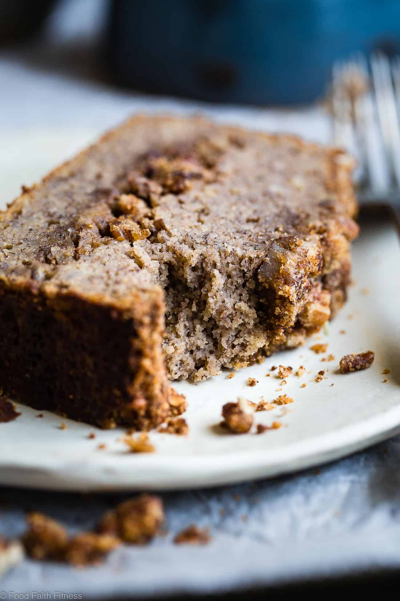 The Best Paleo Banana Bread with Pecan Streusel - This easy Paleo Coconut Flour Banana Bread is gluten/grain/dairy/refined sugar free but perfectly moist and sweet! The pecan topping MAKES it so addicting and you'll never know it's healthy! | Foodfaithfitness.com | @FoodFaithFit