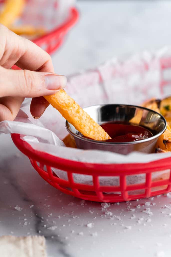 Keto French Fries being dipped into ketchup