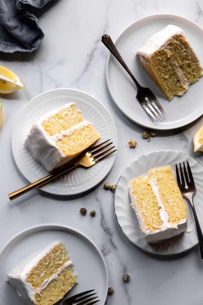 several slices of Vegan Lemon Cake on dessert plates