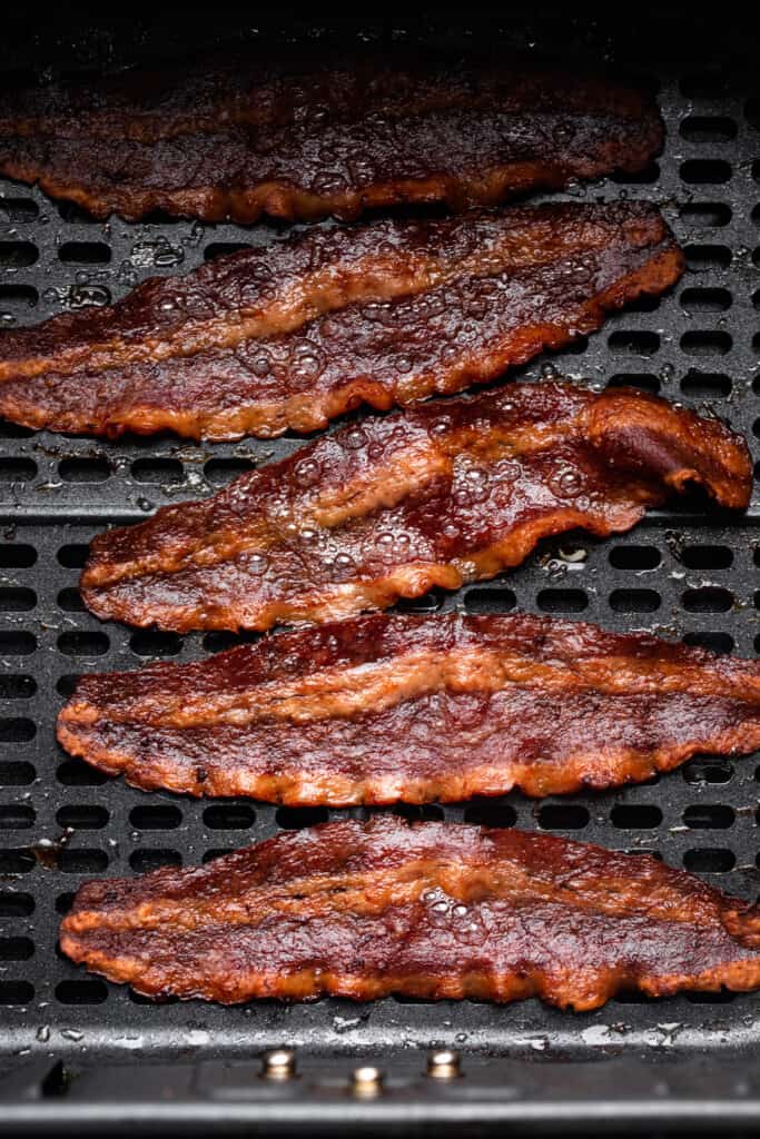 cooked Air Fryer Turkey Bacon on an air fryer tray